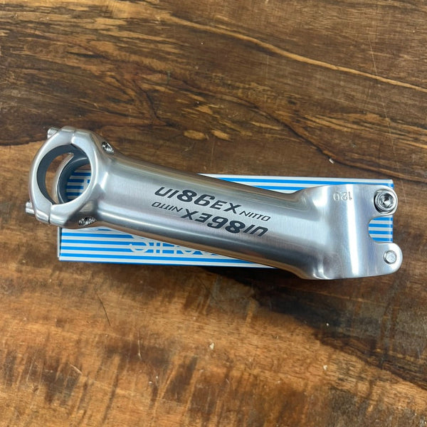 Nitto Bicycle stem on a wooden surface with UI86EX branding