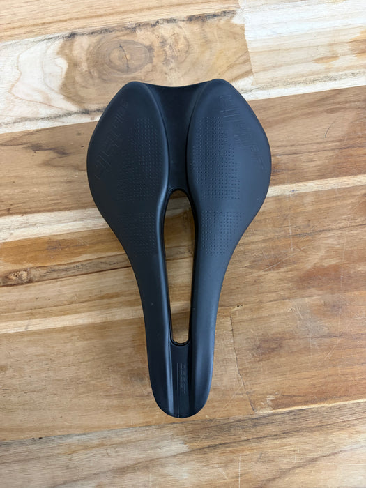 Selle Italia Model X Boost Superflow saddle, side profile showing the FeC steel rails and waved shape