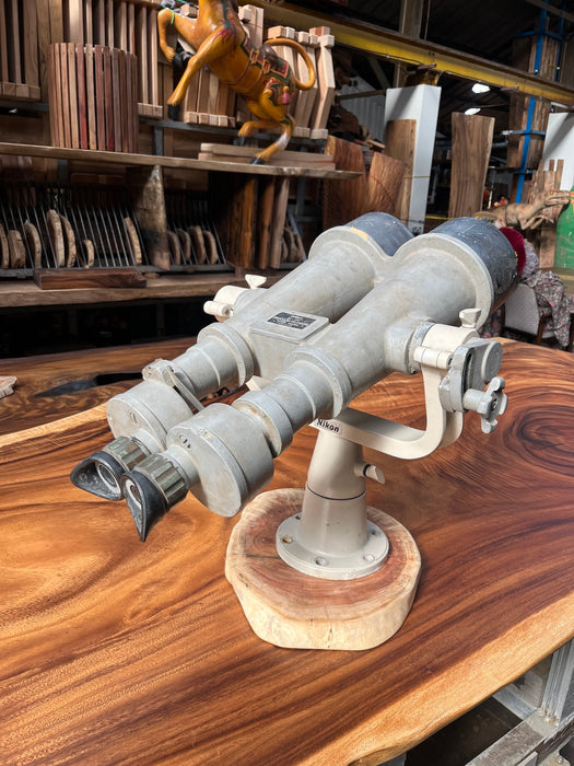 Salvaged Nikon 20x120 binocular telescope viewed from the eyepiece end on its fork mount