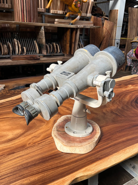 Nikon 20x120 binocular telescope, three-quarter view on wooden base
