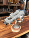 Nikon 20x120 binocular telescope, three-quarter view on wooden base