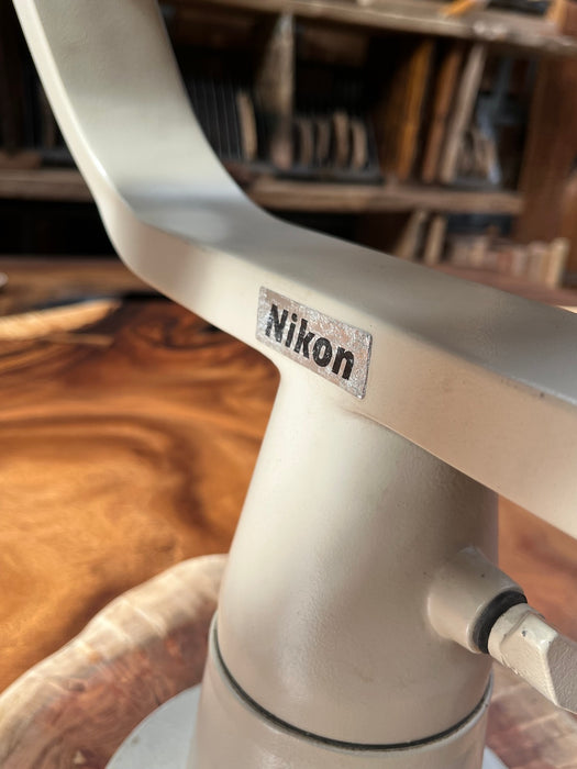 Nikon badge on the fork mount of a salvaged binocular telescope