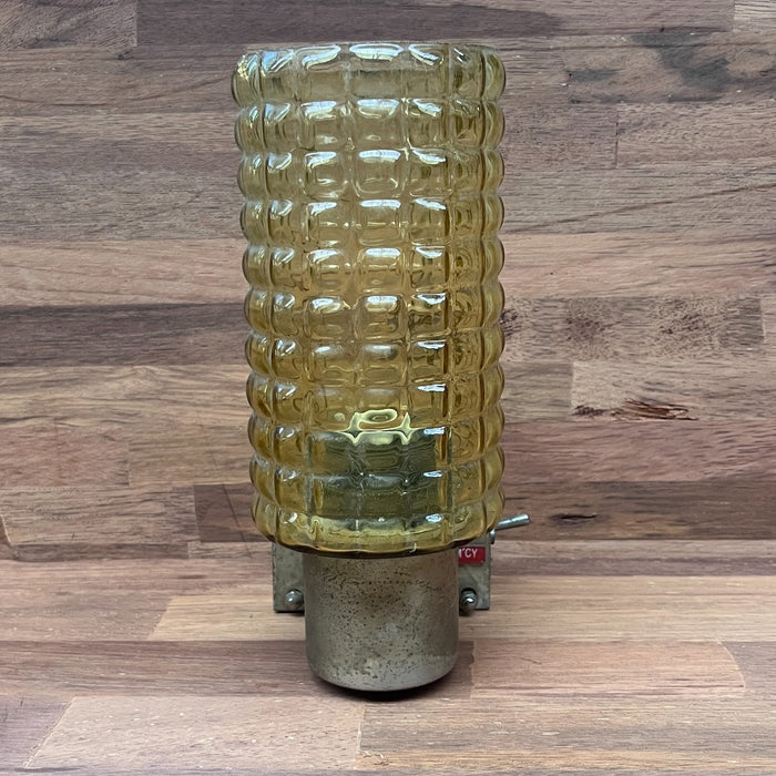Salvaged Kokosha brass wall light with textured amber glass shade