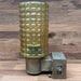 Back plate of salvaged Kokosha wall light showing fixing holes
