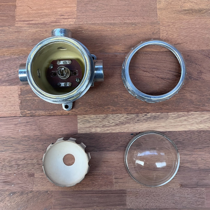 Polished cast aluminium marine bulkhead light with glass dome and cream reflector