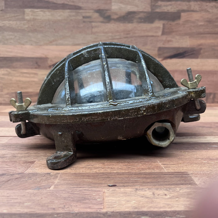 Salvaged bulkhead light, close view of iron body and finish
