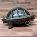 Salvaged bulkhead light, close view of iron body and finish