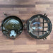 Salvaged bulkhead light shown against plain background