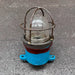 Side view of salvaged iron ship security light showing two cable entries and mounting tabs
