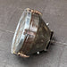 Side angle of VEB industrial steel ceiling light showing aged lacquered finish and polished steel front rim