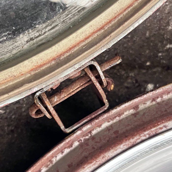 Close-up of aged steel hinge on the hinged glass front of a VEB cargo light