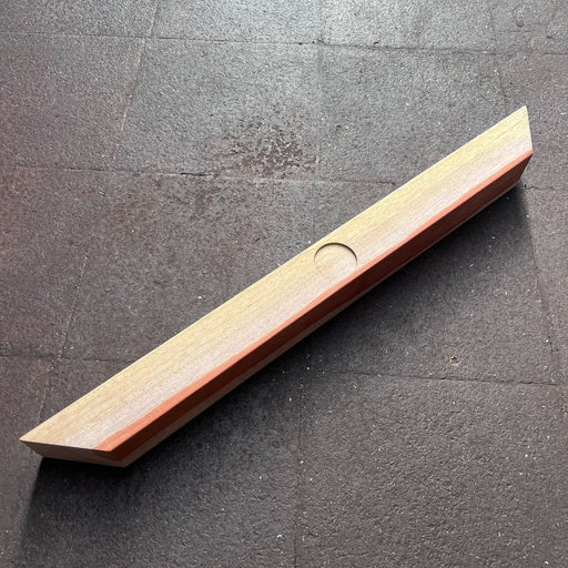 Single 7cm section hardwood divider piece with angled mitre ends and a round recess in the centre