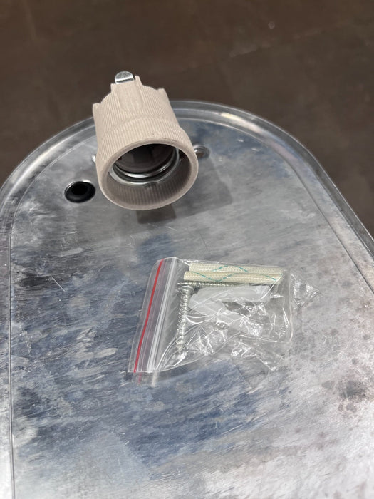 Top-down view of black aluminium oval bulkhead light with ribbed glass