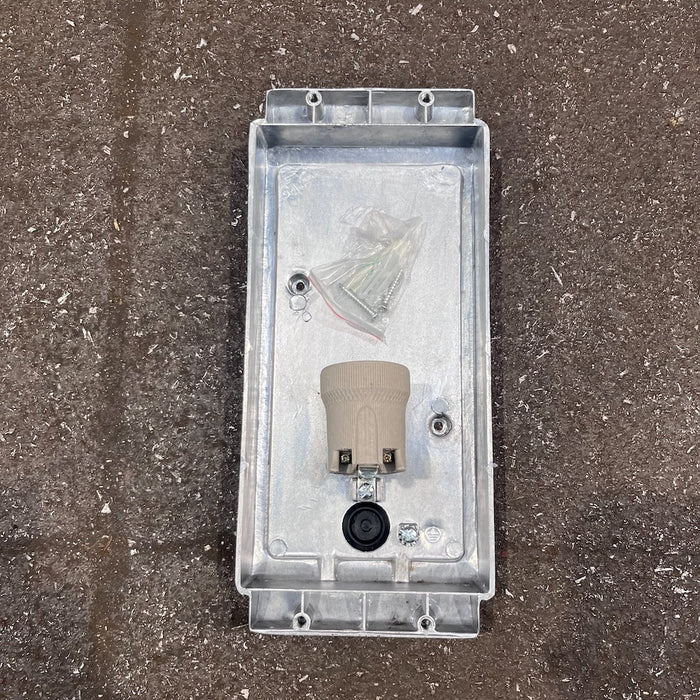 Aluminium marine bulkhead wall light, front view of three-bar guard and ribbed glass