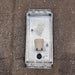 Aluminium marine bulkhead wall light, front view of three-bar guard and ribbed glass