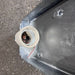 Back of an aluminium marine bulkhead light showing mounting holes and cable entry