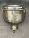 Salvaged polished spun steel pendant light shown from the side with glass front clamps