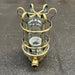 Ceramic lamp holder and threaded brass base of a Palazzoli passageway light