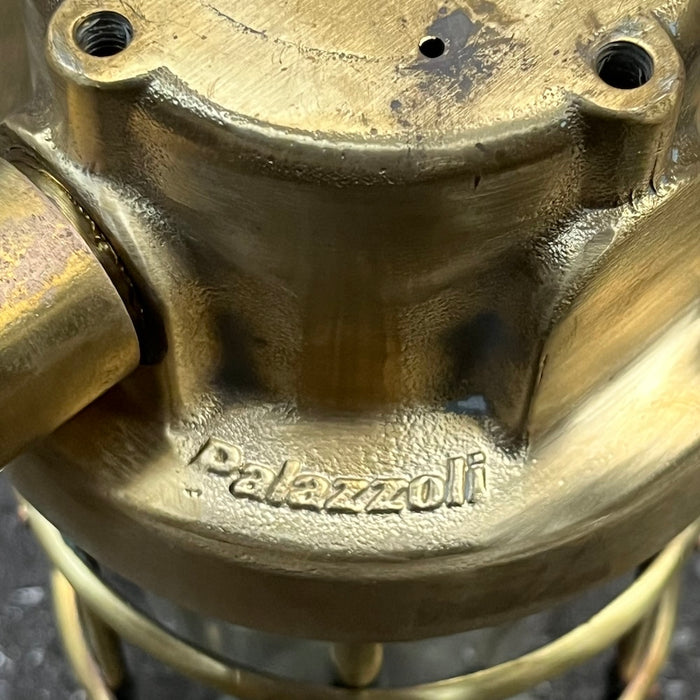 Salvaged brass passageway light, front view of cage, glass dome and ceramic lamp holder