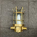 Palazzoli brass passageway light taken apart, showing cage and glass dome beside base and lamp holder