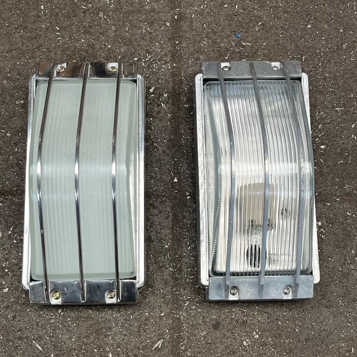 Aluminium marine bulkhead wall light with bar guard, polished milky glass and raw clear ribbed glass versions side by side