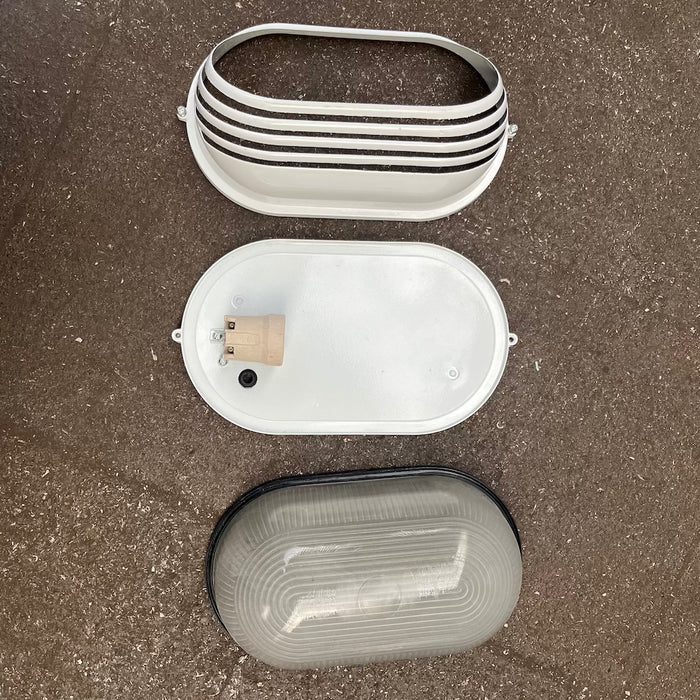 Oval aluminium bulkhead light with louvred guard, detail view