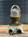 Salvaged mini cast iron marine security light with red painted base, glass dome and guard cage