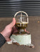 Reclaimed marine caged light with green painted cast iron base and brass collar