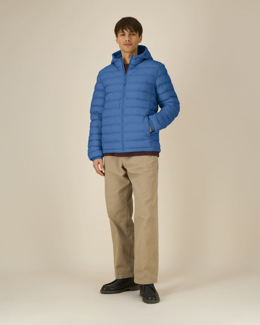 Stanley/Stella Stanley Voyager padded jacket in Mindful Blue worn by model, front view