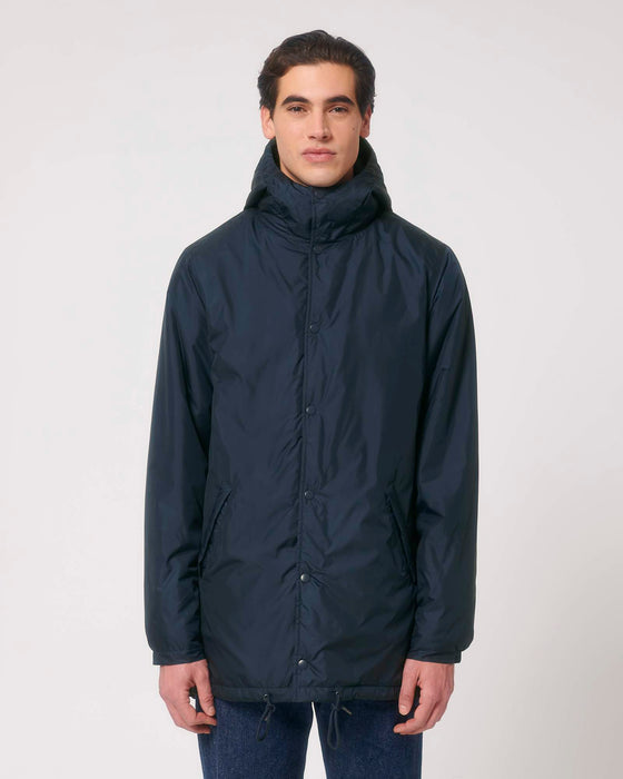 Stanley/Stella SX204 unisex padded parka jacket in French Navy, styled on model