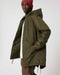 Stanley/Stella SX204 unisex padded parka jacket in British Khaki, side view on model