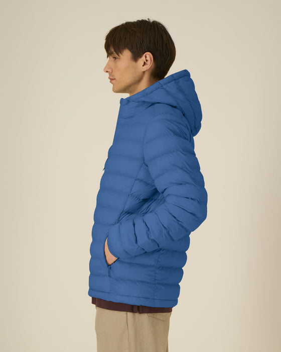 Stanley/Stella Stanley Voyager padded jacket in Mindful Blue, side view on model