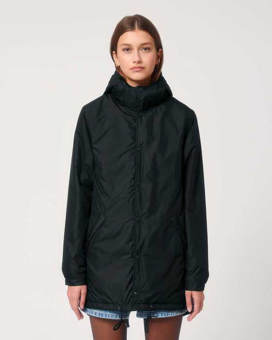 Stanley/Stella SX204 unisex padded parka jacket in Black, close-up on model